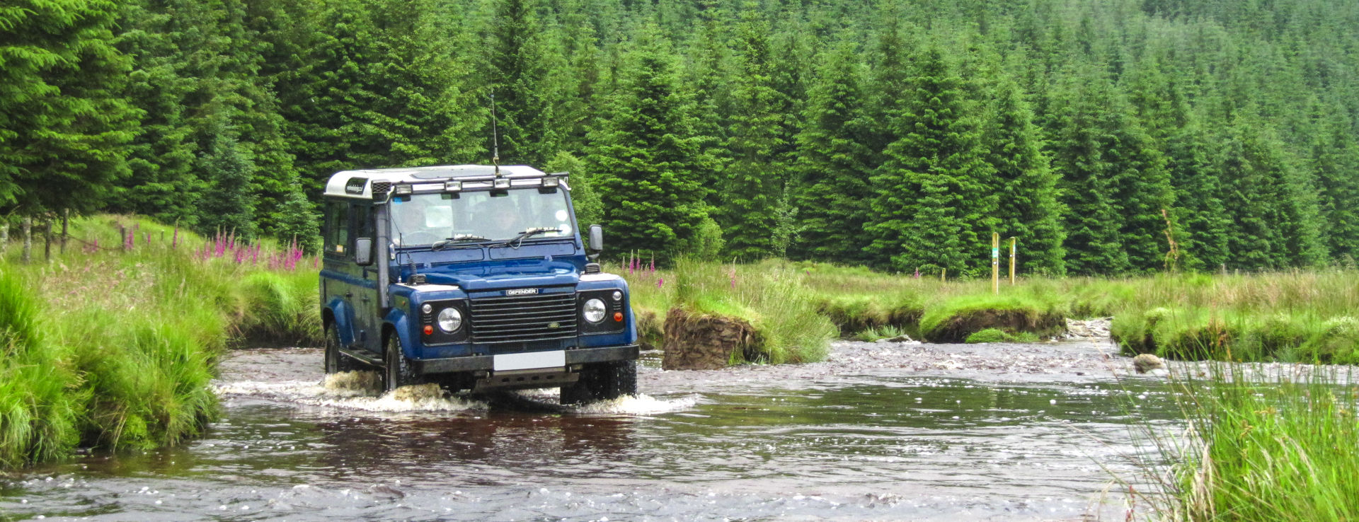 Land Rover Defender fording a tribitory of the Towy near Strata Florida