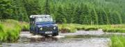 Land Rover Defender fording a tribitory of the Towy near Strata Florida
